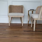 Two chairs and a wooden floor in a room