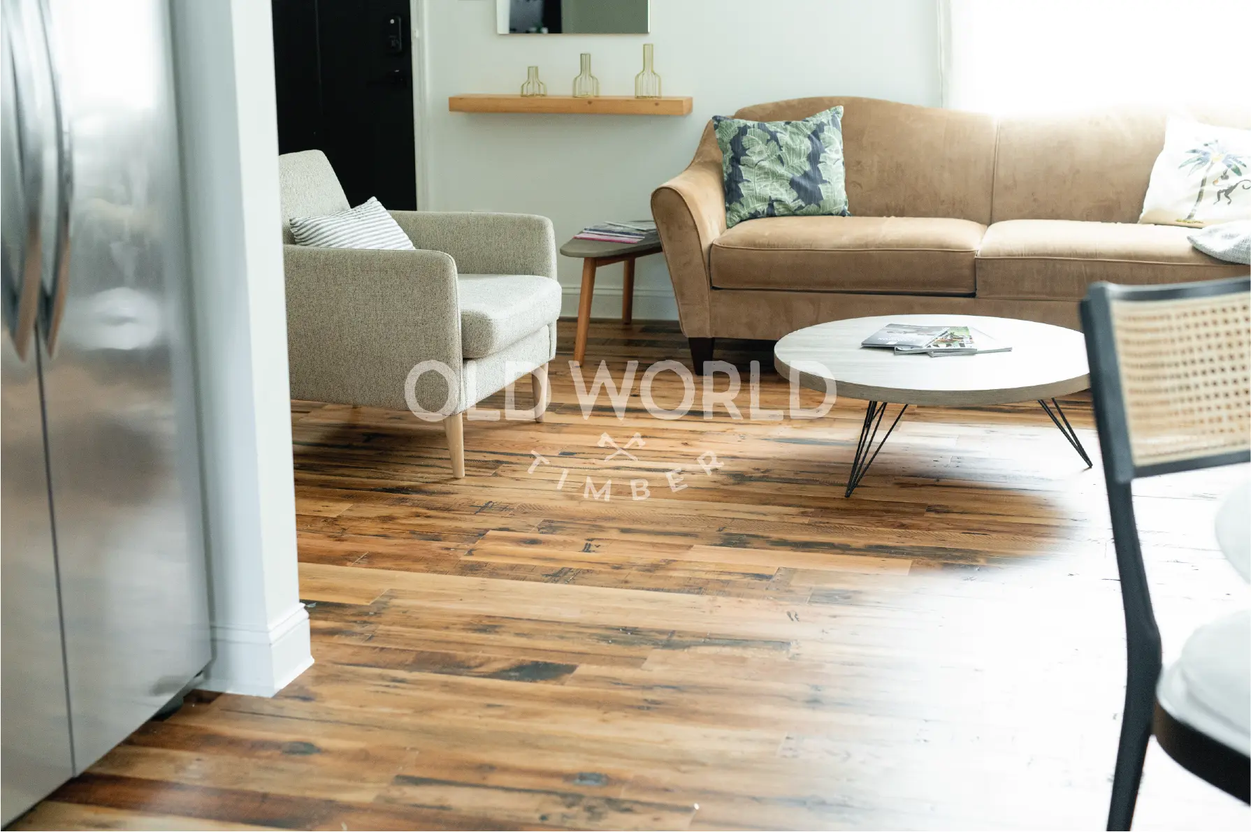 Open living room with Industrial Oak flooring, neutral furniture, and natural light highlighting the reclaimed wood’s patina.