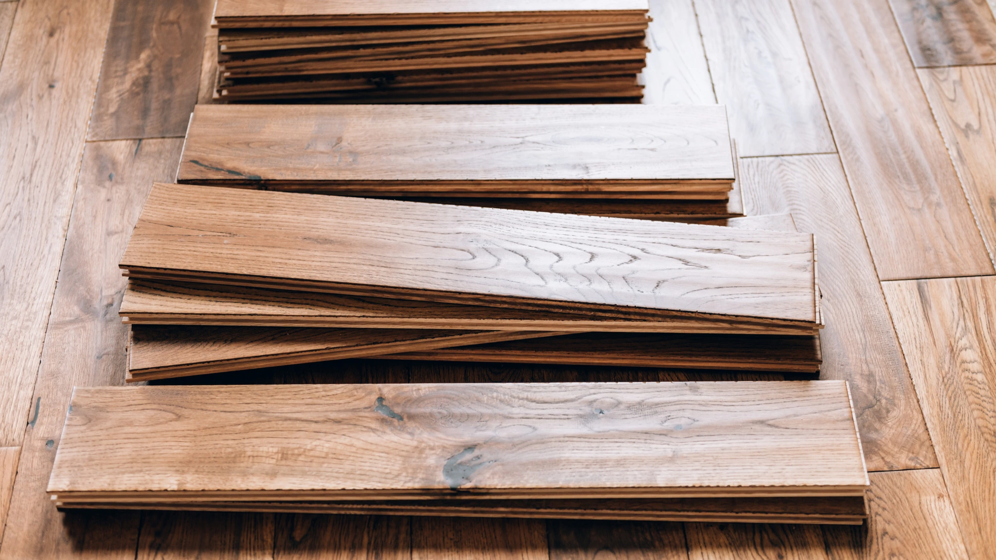 recycled wood boards placed on a wood flooring