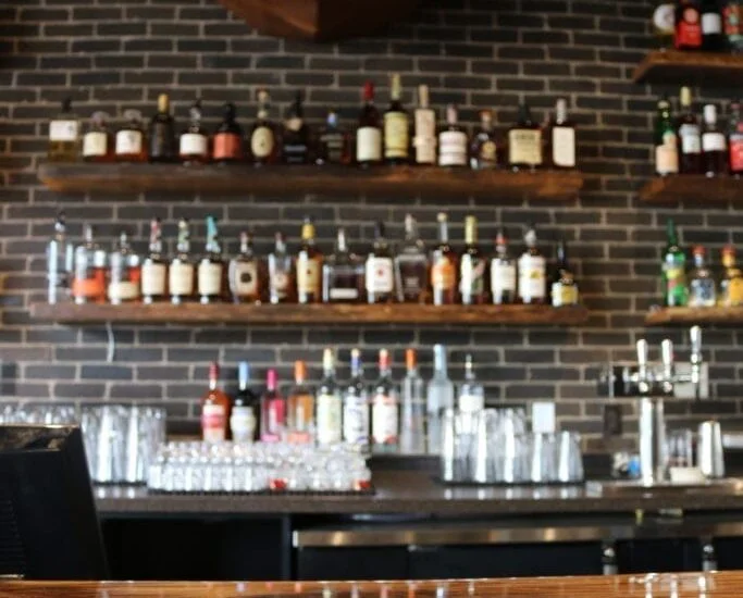 Reclaimed Bar and Table Tops & Whitewashed Wallboard Paneling
