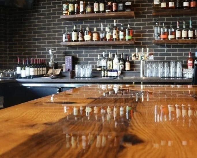 Reclaimed Bar and Table Tops & Whitewashed Wallboard Paneling