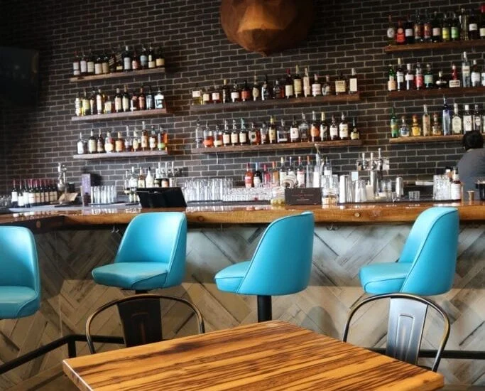 Reclaimed Bar and Table Tops & Whitewashed Wallboard Paneling
