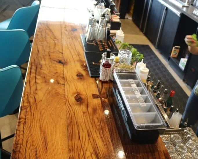 Reclaimed Bar and Table Tops & Whitewashed Wallboard Paneling