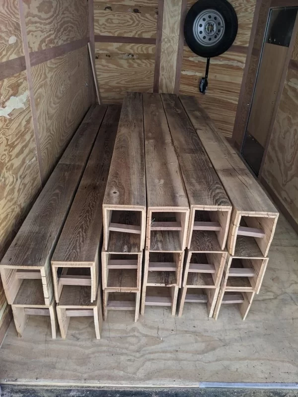 16 custom box beams placed in a transport truck
