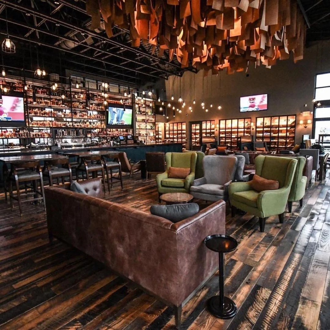 a bar restaurant with reclaimed wood flooring