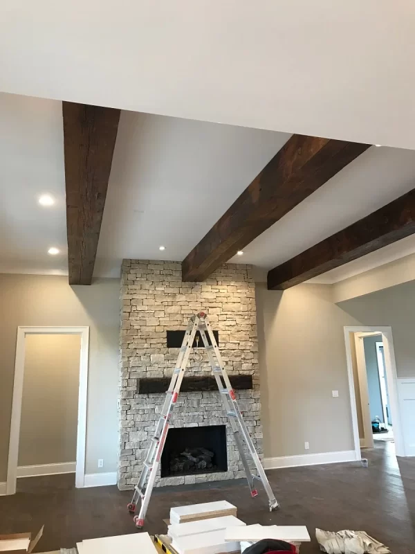 installation in a living room of three custom box beams
