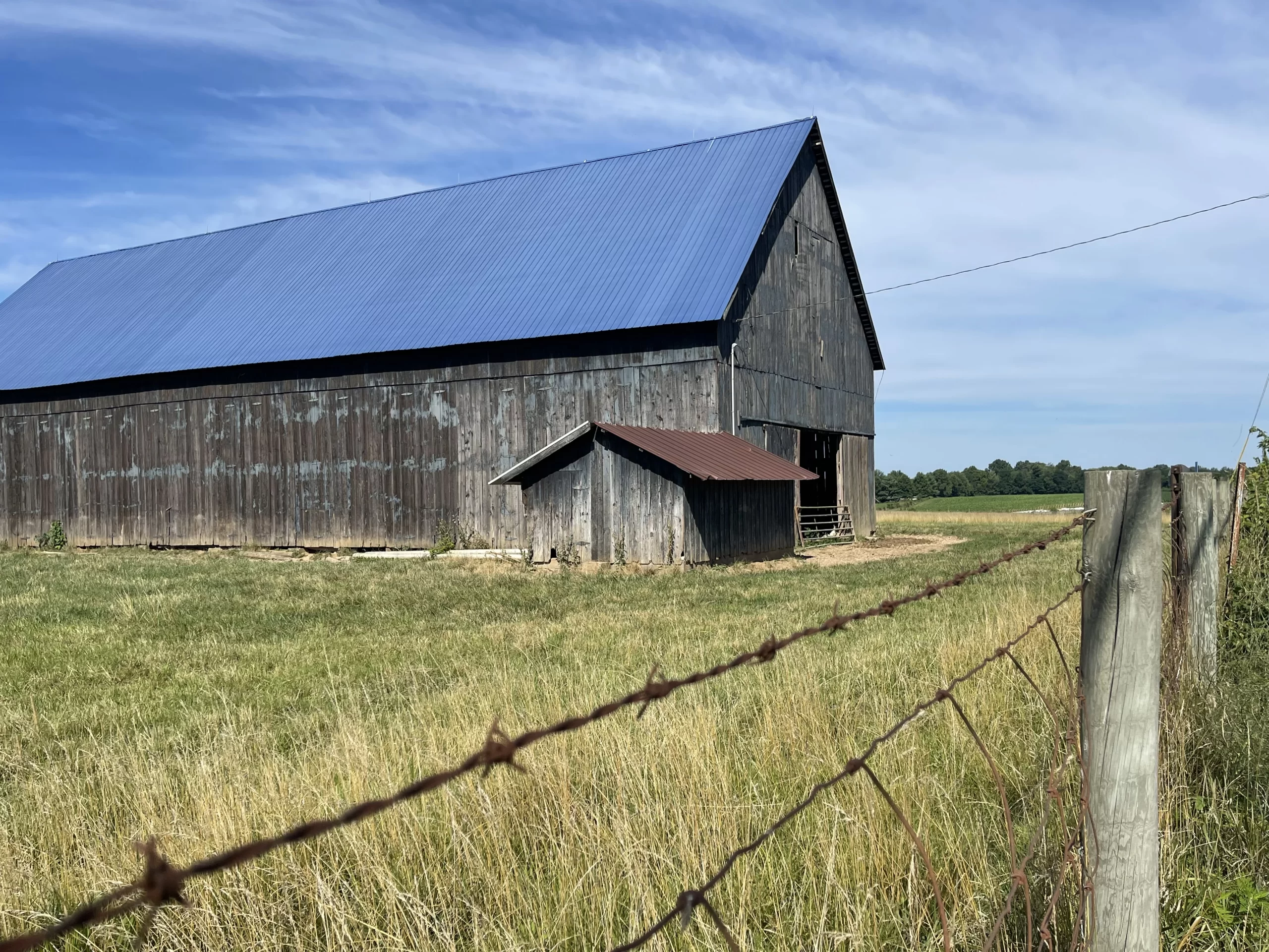 An old barn in a field