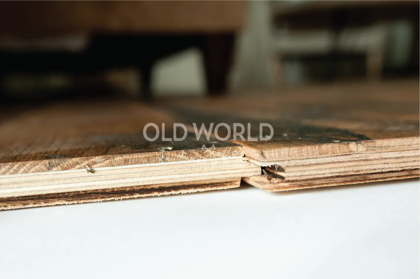 Detailed side view of Heartland Barnwood Mixed Oak engineered flooring plank showing layered plywood base and reclaimed oak wear layer.
