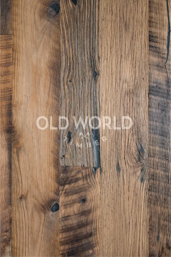 Detailed view of heavily weathered Heartland Barnwood Mixed Oak planks showing reclaimed character and natural texture variation.