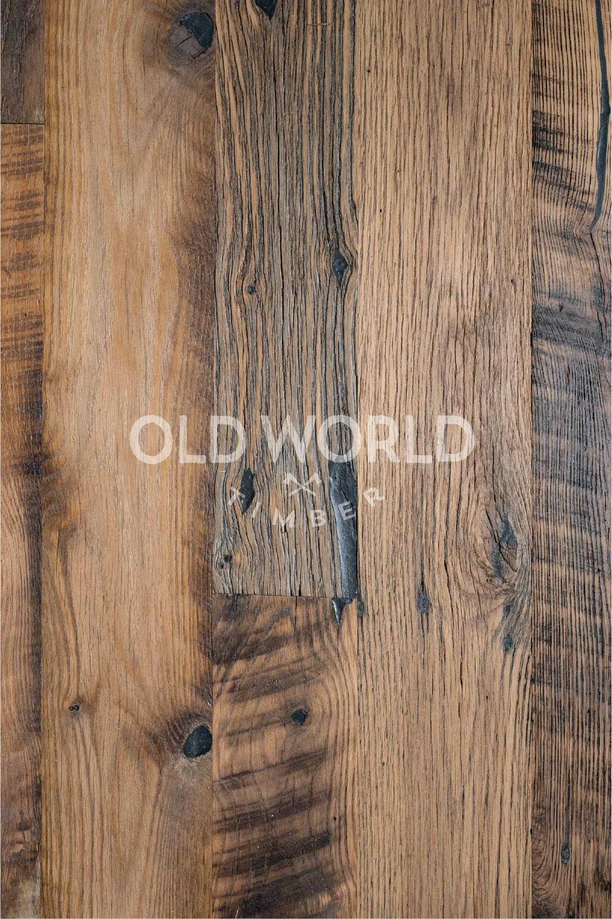 Detailed view of heavily weathered Heartland Barnwood Mixed Oak planks showing reclaimed character and natural texture variation.