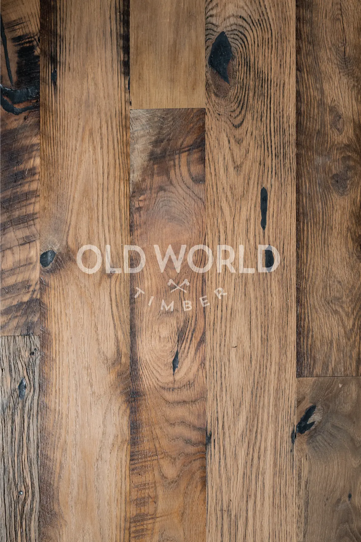 Vertical close-up view of Heartland Barnwood Mixed Oak engineered reclaimed flooring highlighting wood grain, knots, and nail holes.