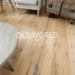 Engineered flooring made from reclaimed white oak, showing rich tones and tight grain from industrial warehouse wood.