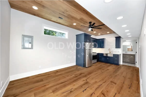 Wide view of a modern kitchen and dining space featuring Modern Harvest engineered oak flooring with smooth tones and subtle rustic details.