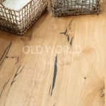 Wide planks of Modern Harvest Oak Flooring with dark natural imperfections, offering the feel of reclaimed wood in a modern home.