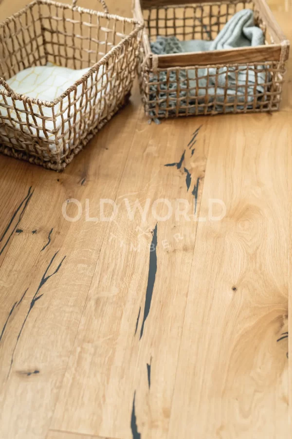 Wide planks of Modern Harvest Oak Flooring with dark natural imperfections, offering the feel of reclaimed wood in a modern home.