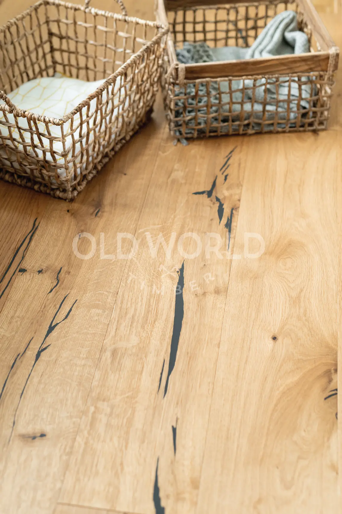 Wide planks of Modern Harvest Oak Flooring with dark natural imperfections, offering the feel of reclaimed wood in a modern home.