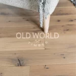 Engineered reclaimed oak flooring with clean finish, sourced from North American warehouse structures.