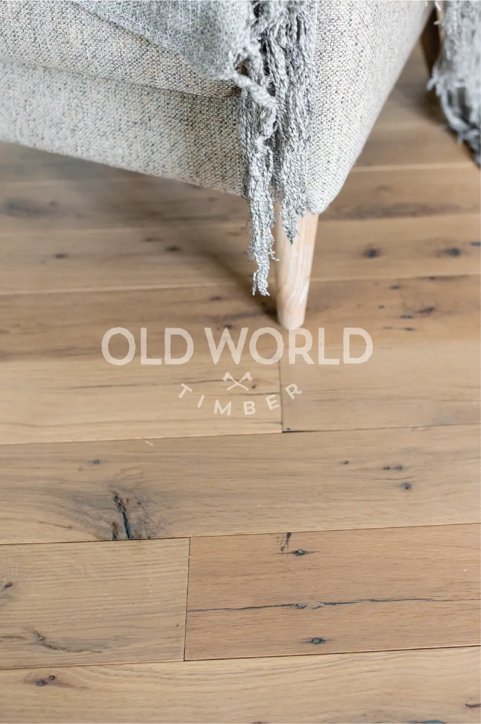 Engineered reclaimed oak flooring with clean finish, sourced from North American warehouse structures.