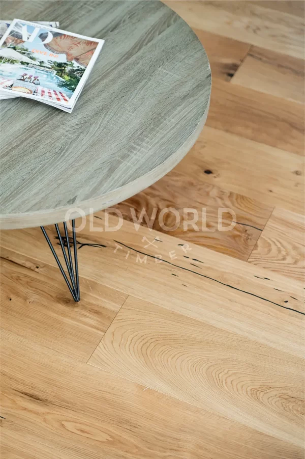 Close-up of Modern Harvest oak planks beside a Frigidaire stove, showcasing filled cracks and sustainable craftsmanship.