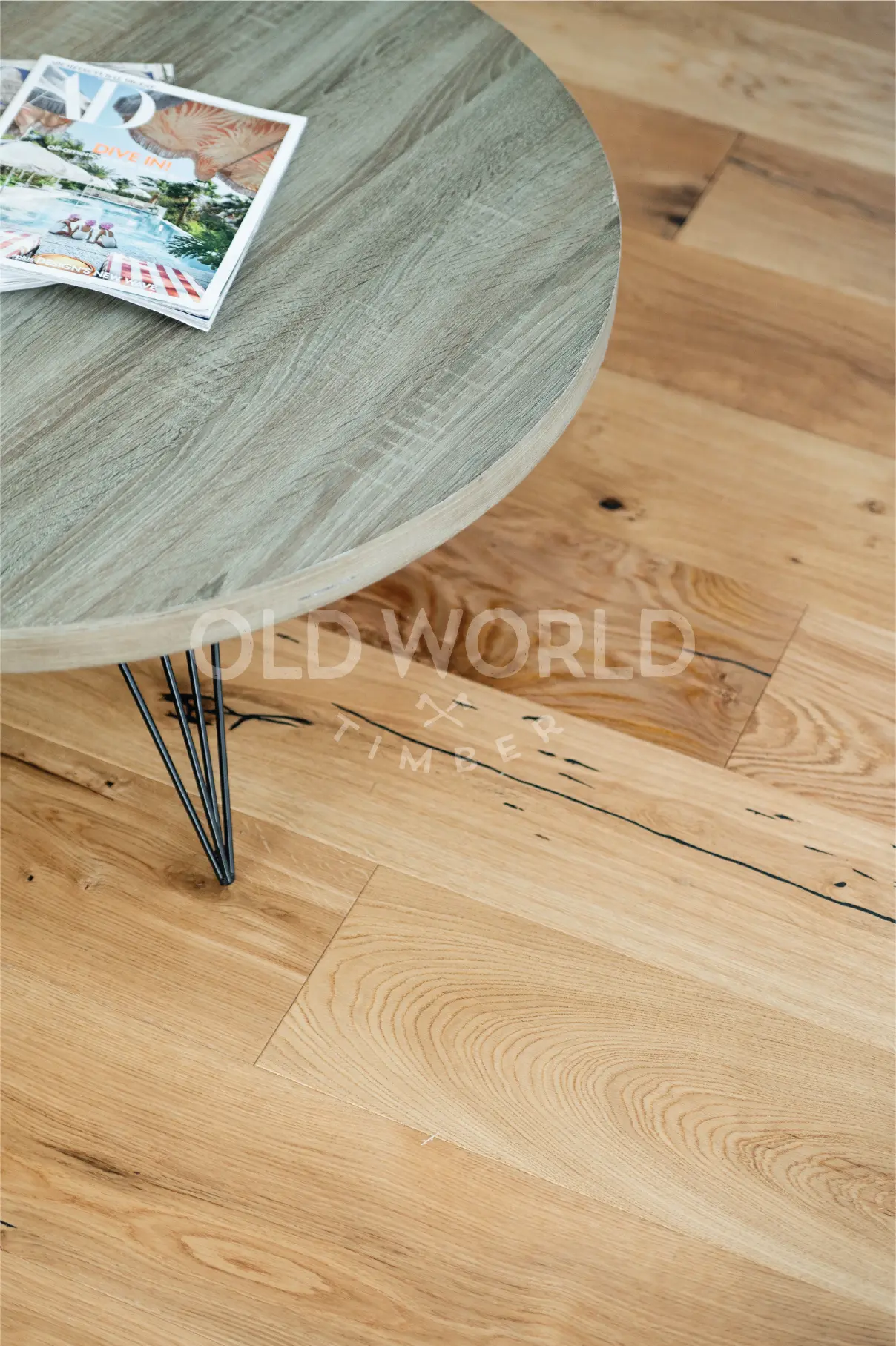 Close-up of Modern Harvest oak planks beside a Frigidaire stove, showcasing filled cracks and sustainable craftsmanship.