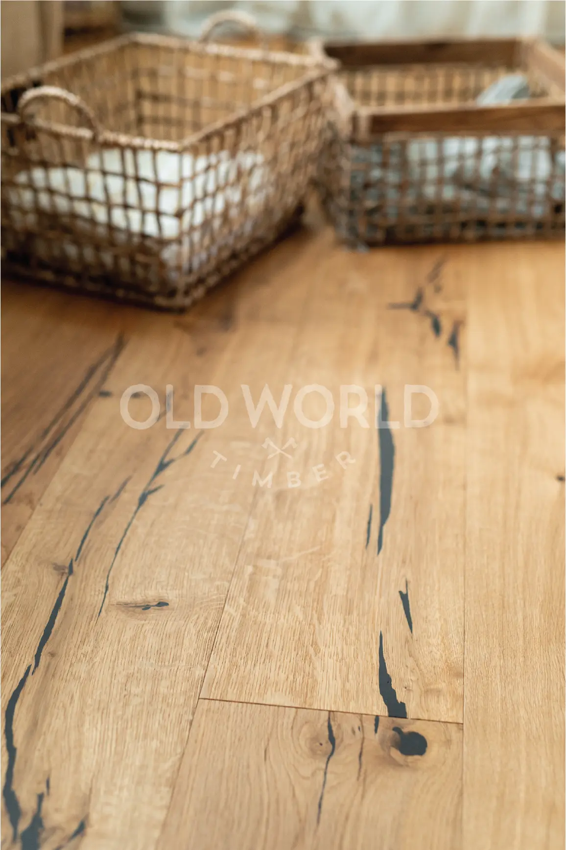Natural oak engineered planks with distinctive dark markings and sustainable craftsmanship, shown beneath woven storage baskets.