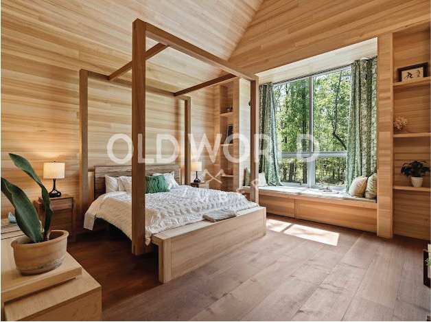 Modern bedroom interior showcasing Oak Rift and Quartered engineered flooring and natural wood walls.