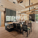 Modern kitchen interior featuring Oak Rift and Quartered engineered flooring and natural wood ceilings.