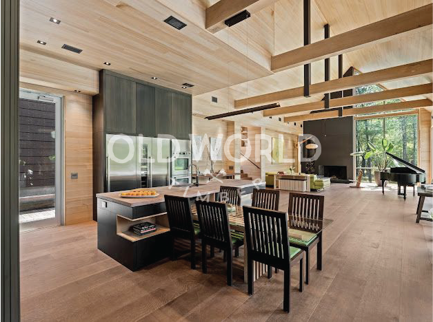 Modern kitchen interior featuring Oak Rift and Quartered engineered flooring and natural wood ceilings.